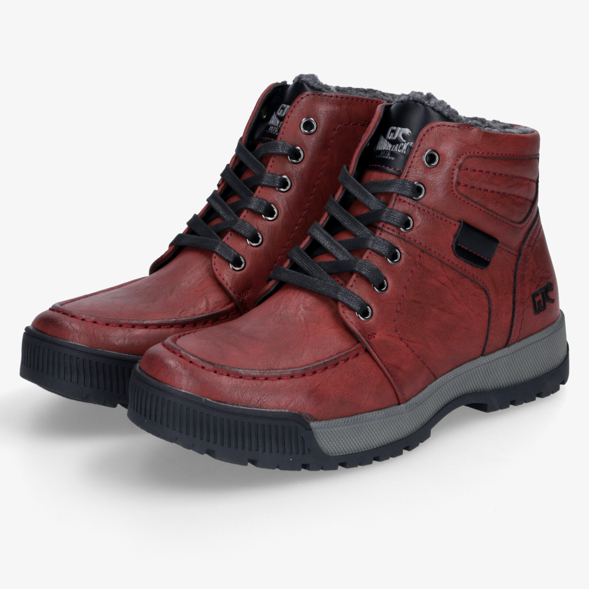 Rotes Paar Winterstiefel mit warmem Innenfutter, robusten Sohlen und schnürbarer Passform für sicheren Halt