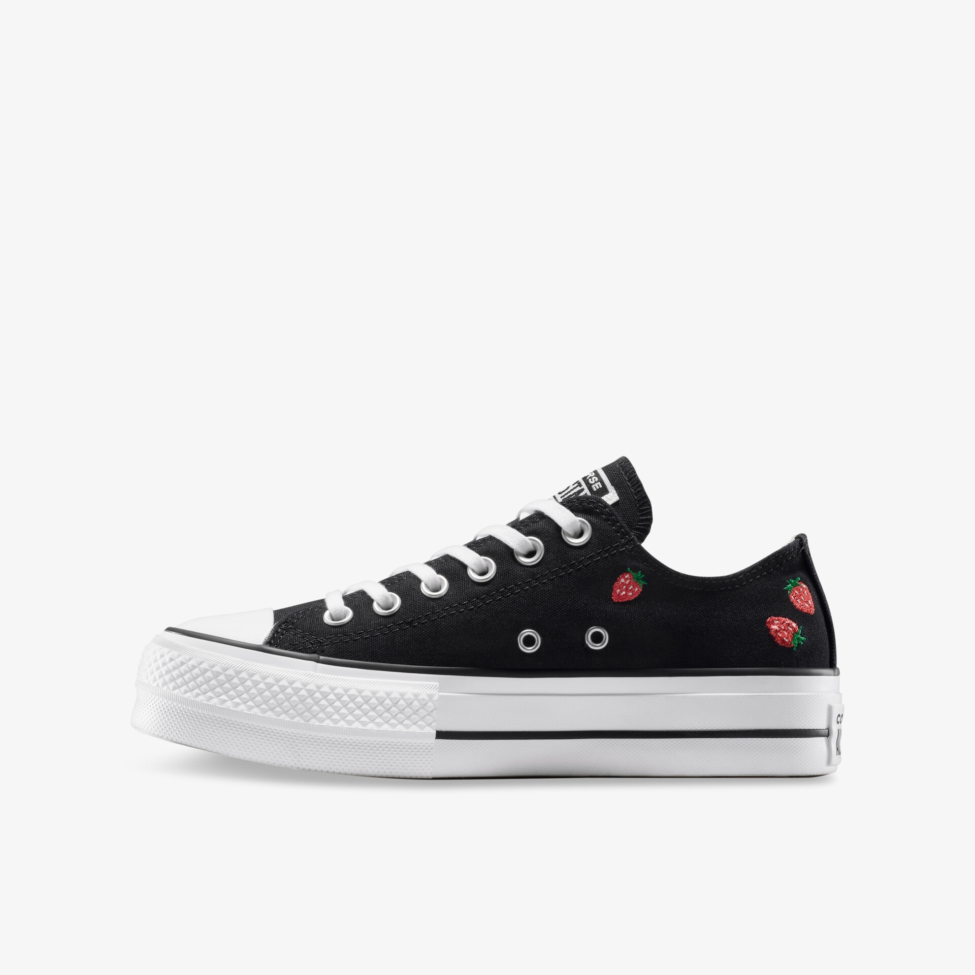 Schwarzer Sneaker mit weißer Gummisohle und floralem Motiv, seitliche Ansicht, klassischer und bequemer Freizeitschuh