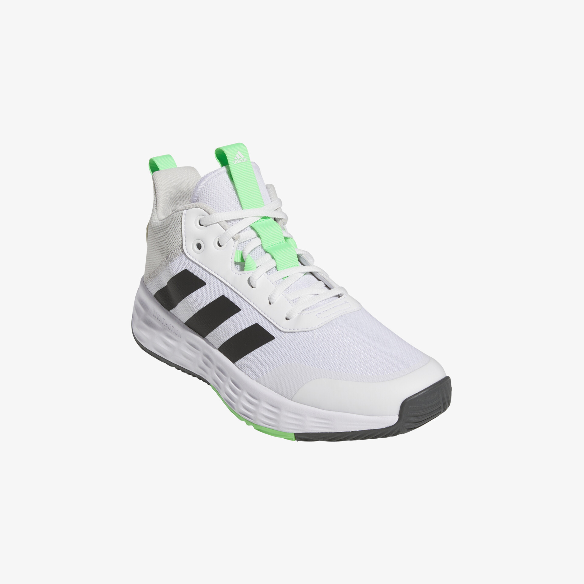 Stilvoller weißer Sneaker mit grünen Akzenten und rutschfester Sohle für optimalen Halt und Komfort.