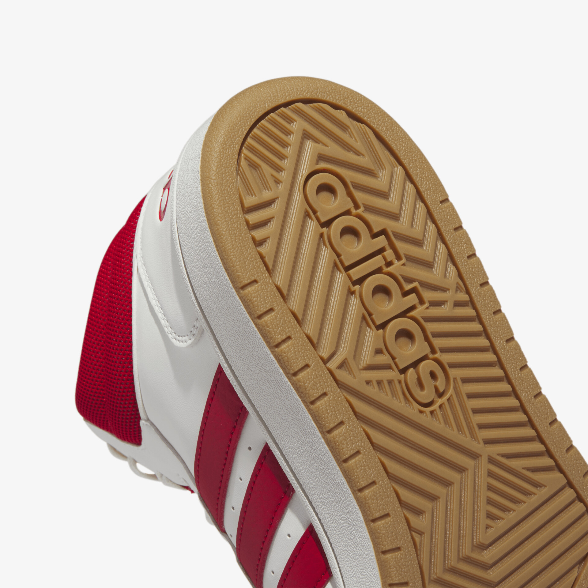 Moderner Sneaker mit rutschfester Sohle und sportlichem Design in Rot-Weiß.