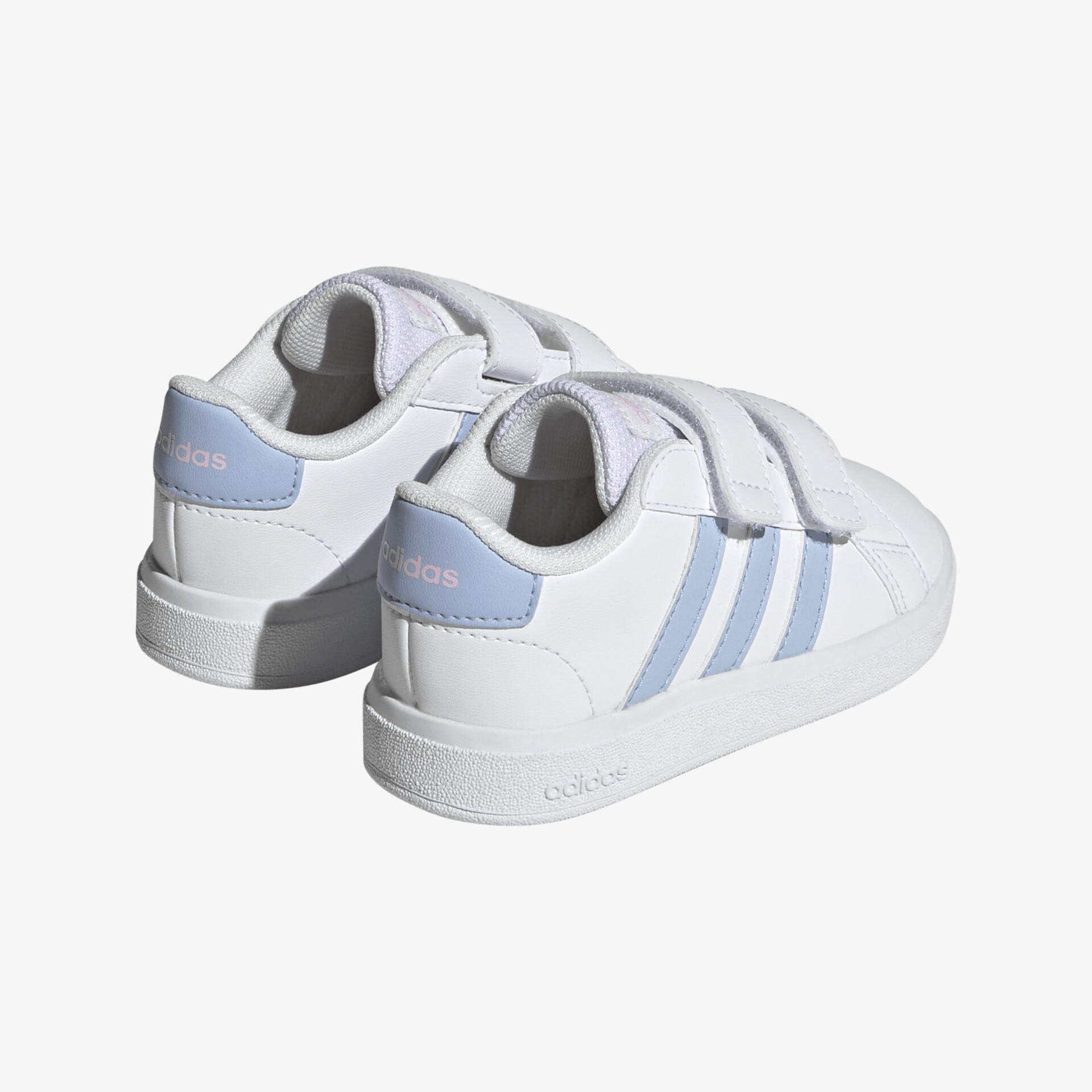 Weiße Schuhe mit blauen Streifen und Klettverschluss; sportliches Design für optimalen Komfort.