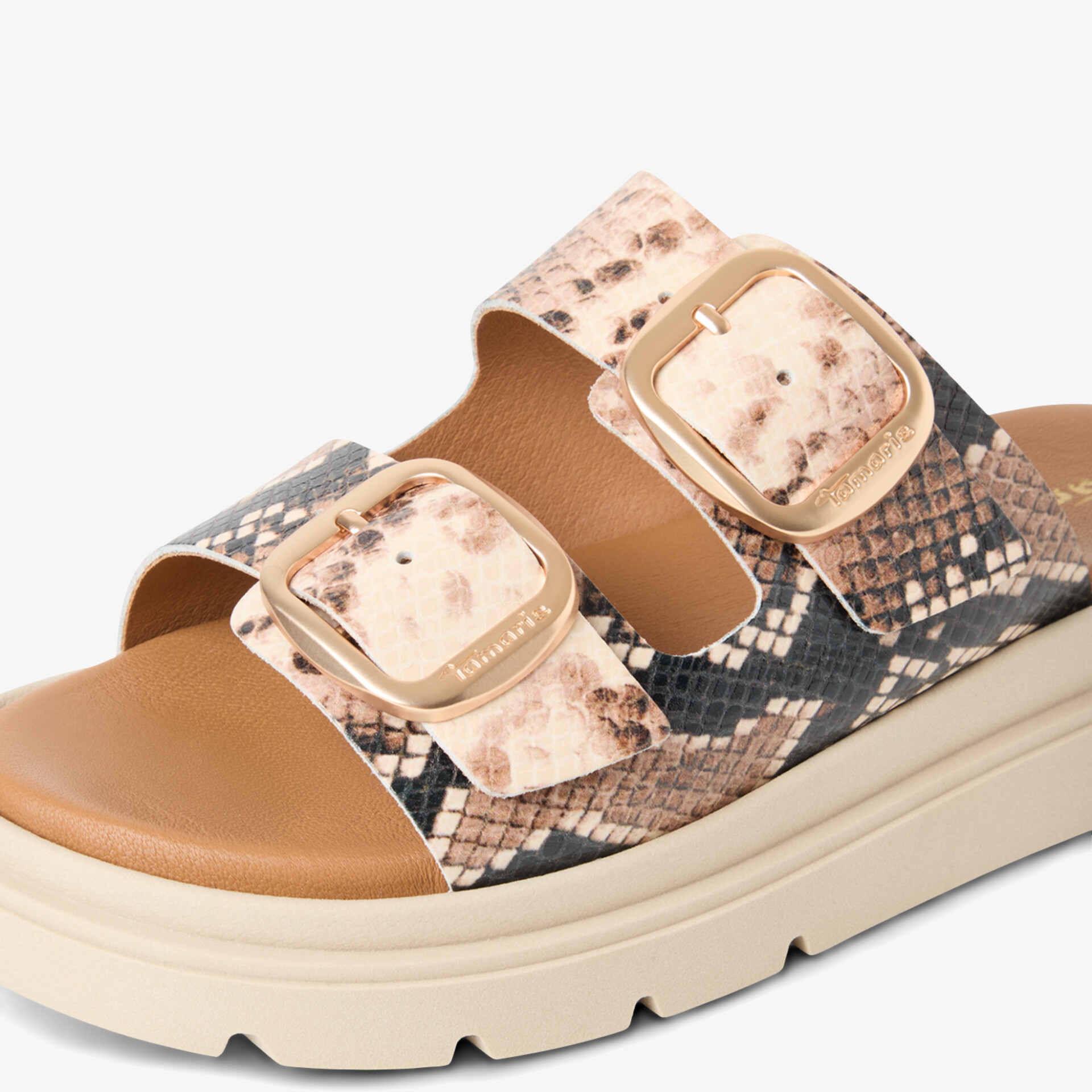 Modische Sandale mit Schlangenmuster und verstellbaren Schnallen auf beigem Plateau