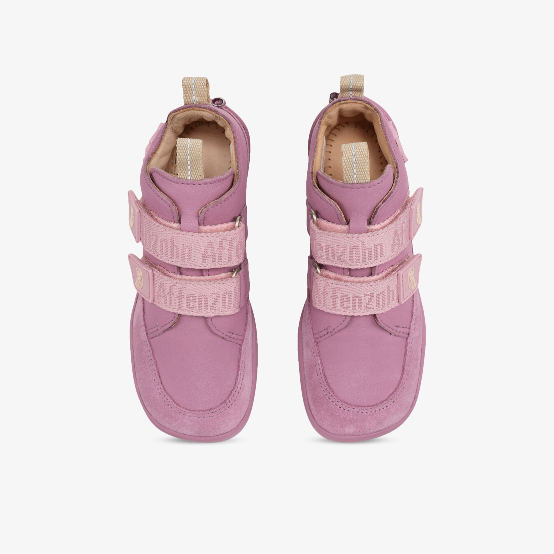 Sportliches rosa Sneaker-Paar mit verstellbaren Klettverschlüssen, leicht gepolstert und robuster Sohle