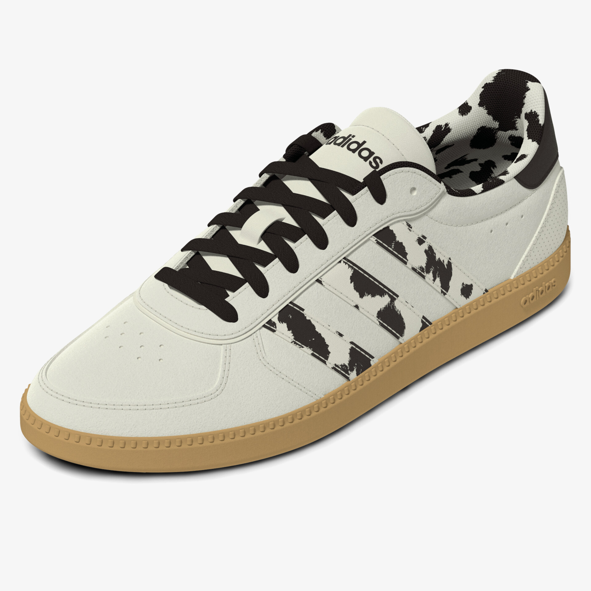 Moderner Sneaker in Weiß mit schwarzem Muster und robuster brauner Gummisohle, bequemer Schuh für Alltag