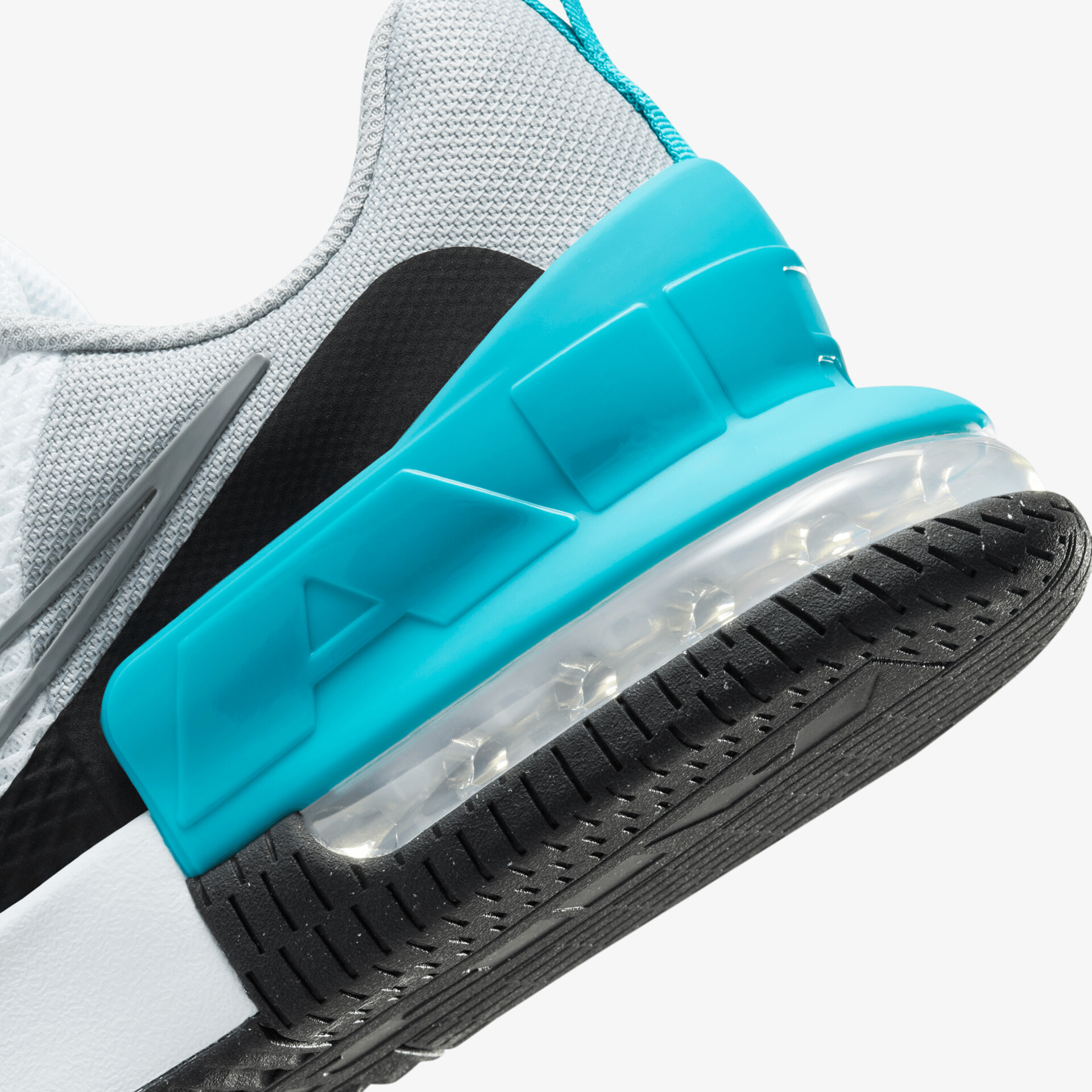 Detailaufnahme einer Dämpfungssohle mit rutschfester Profilsohle und modernem Design in Türkis und Weiß