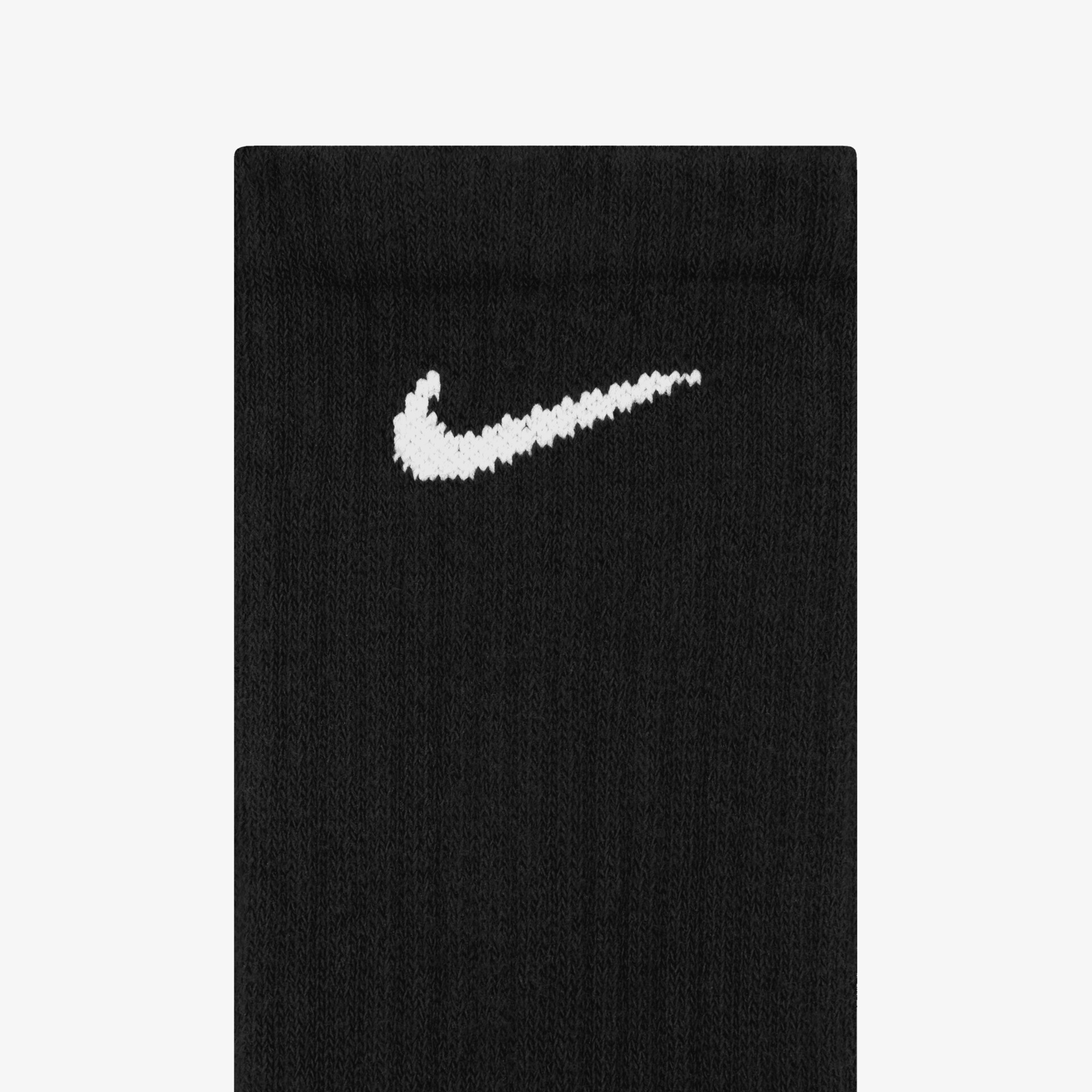 Detailaufnahme einer grauen Sportsocke mit weißem Nike Logo für optimalen Tragekomfort und Halt