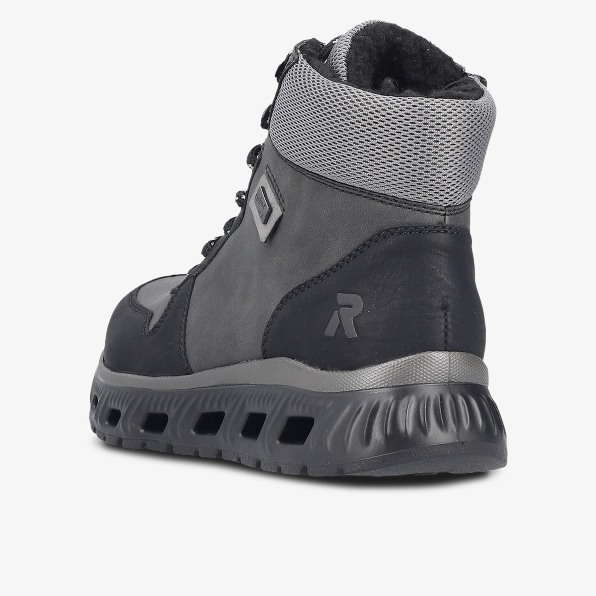 Robuster Winterschuh mit warmer Innenverkleidung und rutschfester Sohle, seitliche Ansicht