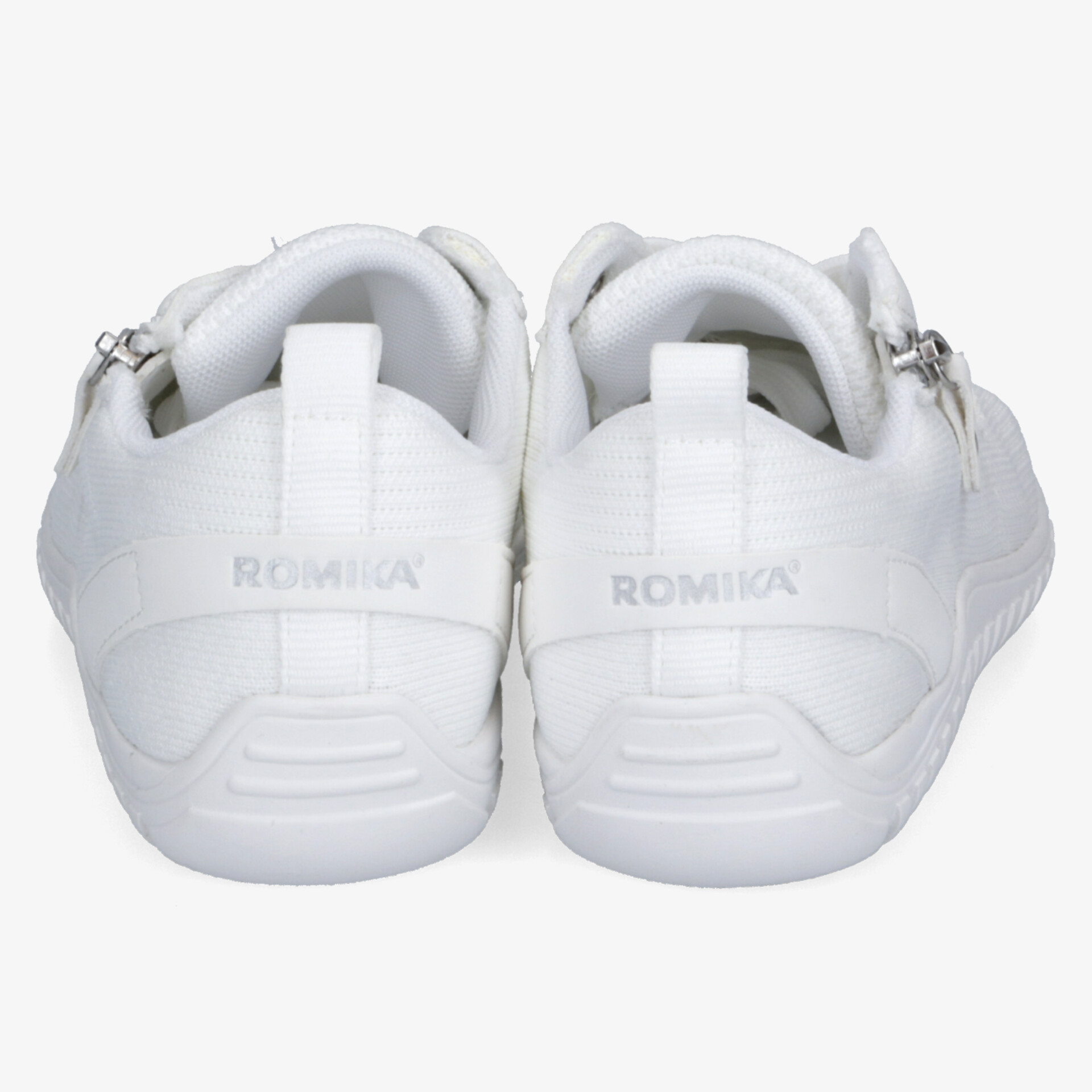 Paar weiße Schuhe mit Reißverschluss, bequem und sportlich, Rückansicht mit rutschfester Sohle sichtbar