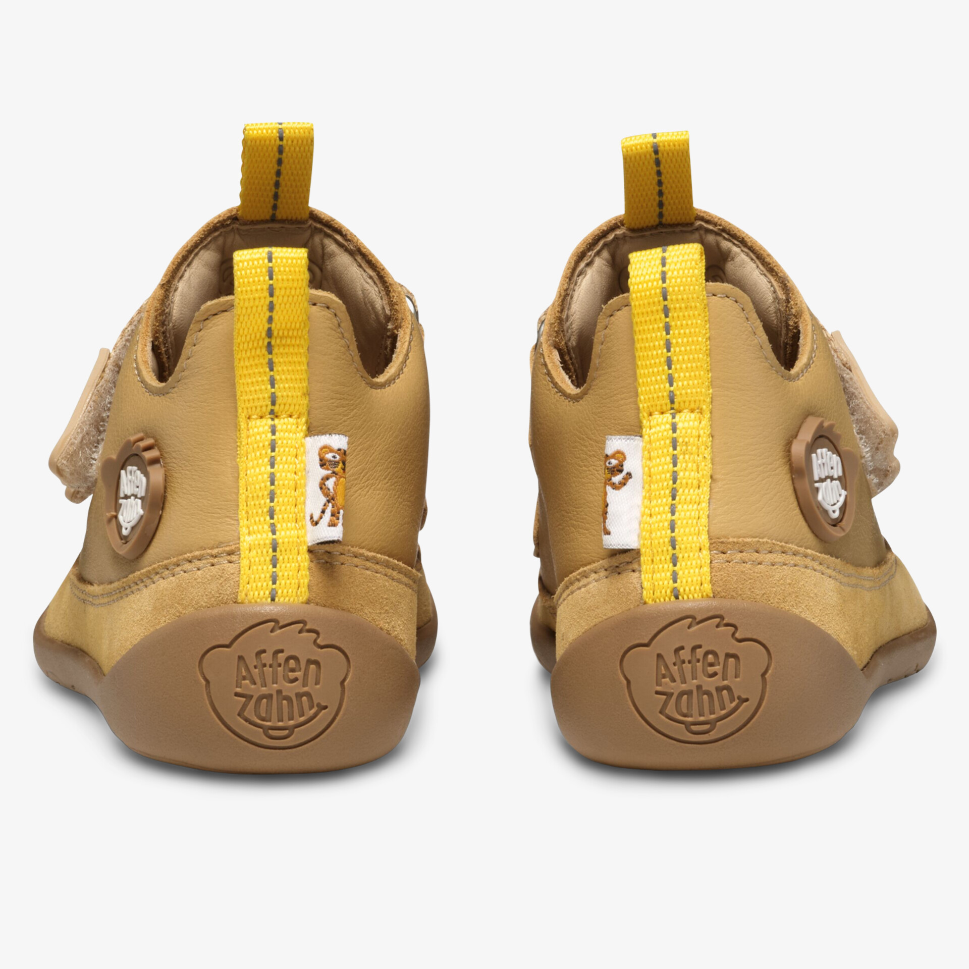 Robuste gelbe Schuhe mit flexibler, rutschfester Sohle und bequemem Einstieg hinten