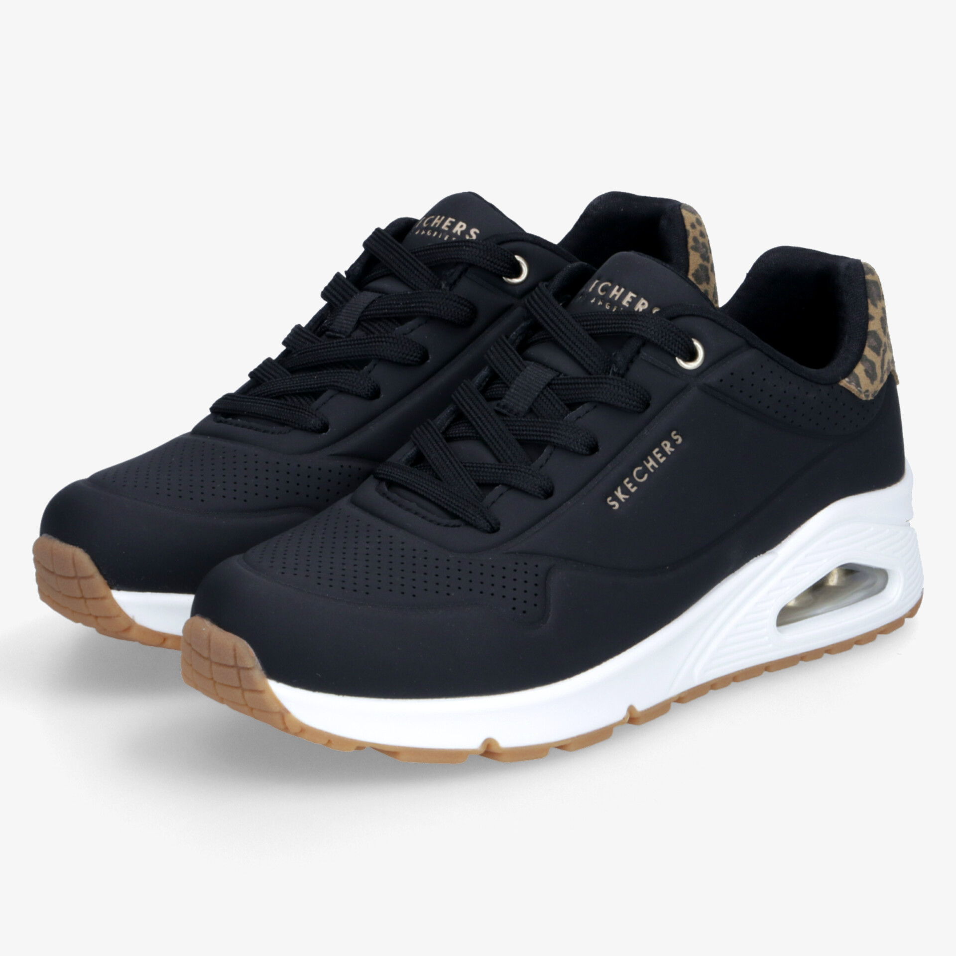 Sportliche schwarz-weiße Sneaker mit gedämpfter Sohle und robuster Schnürung, ideal für Komfort und Alltag