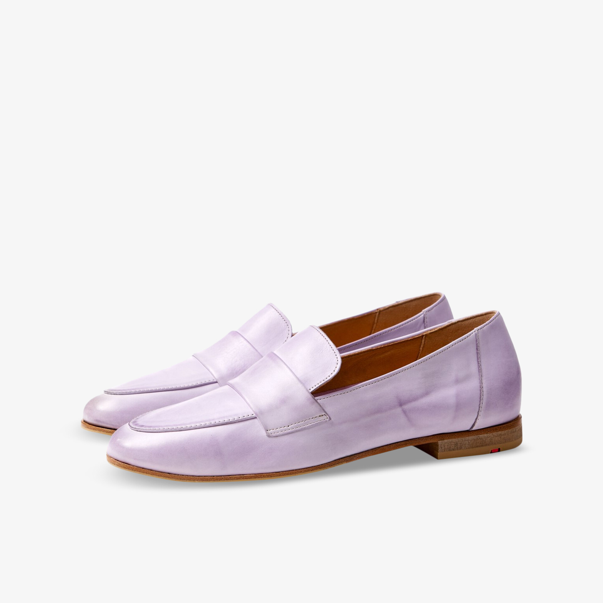 Lila Lederslipper mit elegantem Design für stilvollen Komfort im Alltag.