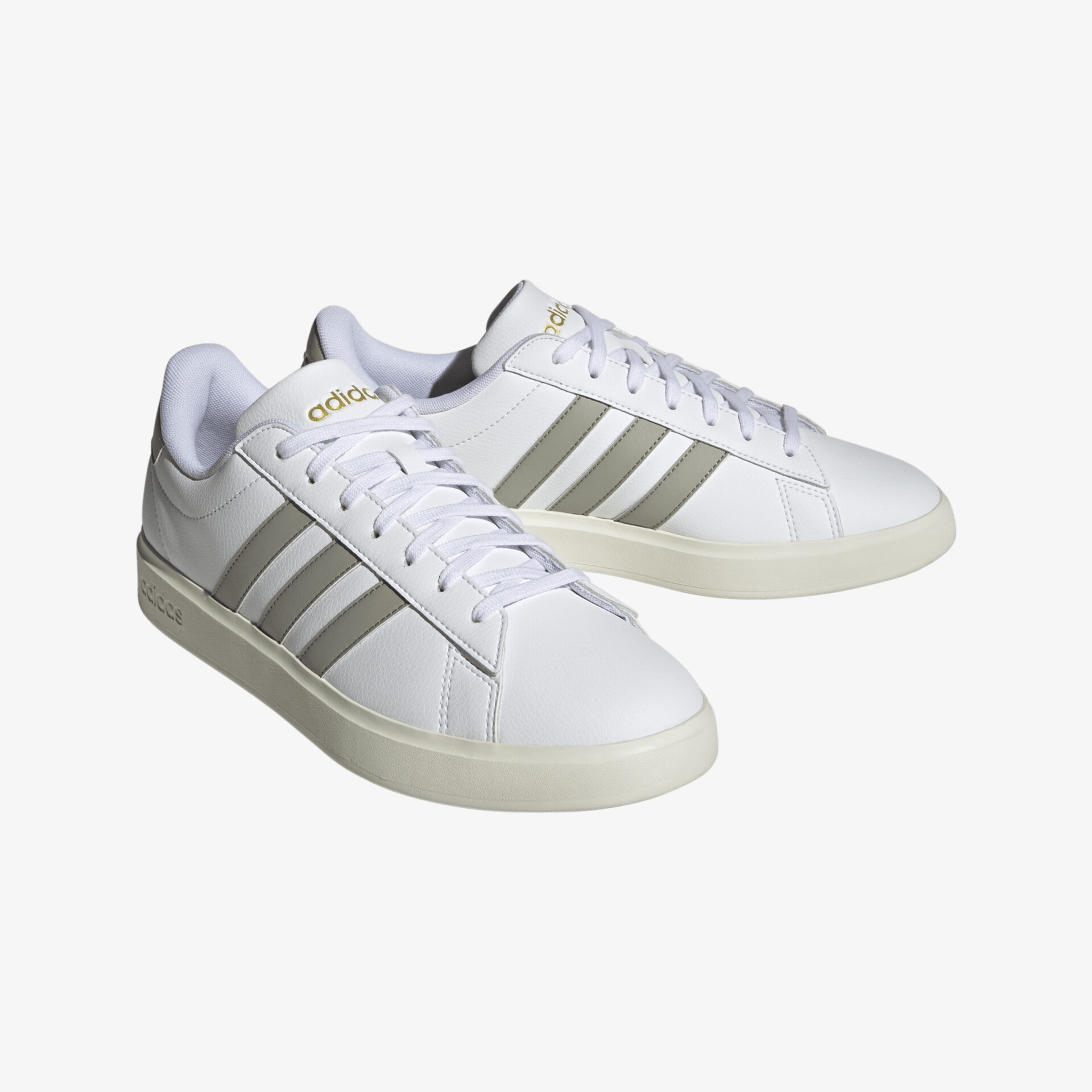 Klassische weiße Turnschuhe mit ikonischen Streifen; ideal für täglichen Komfort und Style.