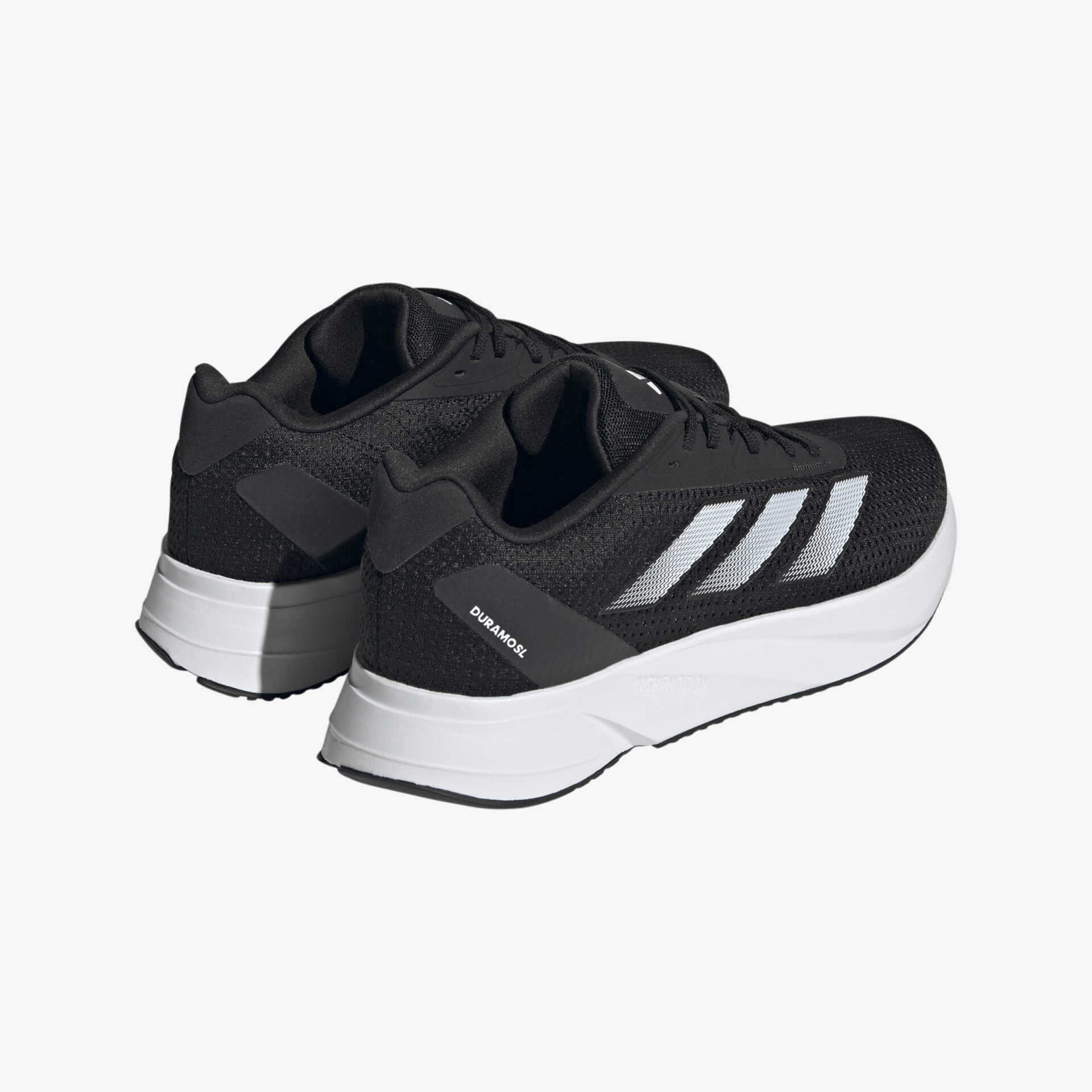 Schwarze und weiße Sportschuhe mit modernem Design und bequemer Passform für den täglichen Gebrauch.