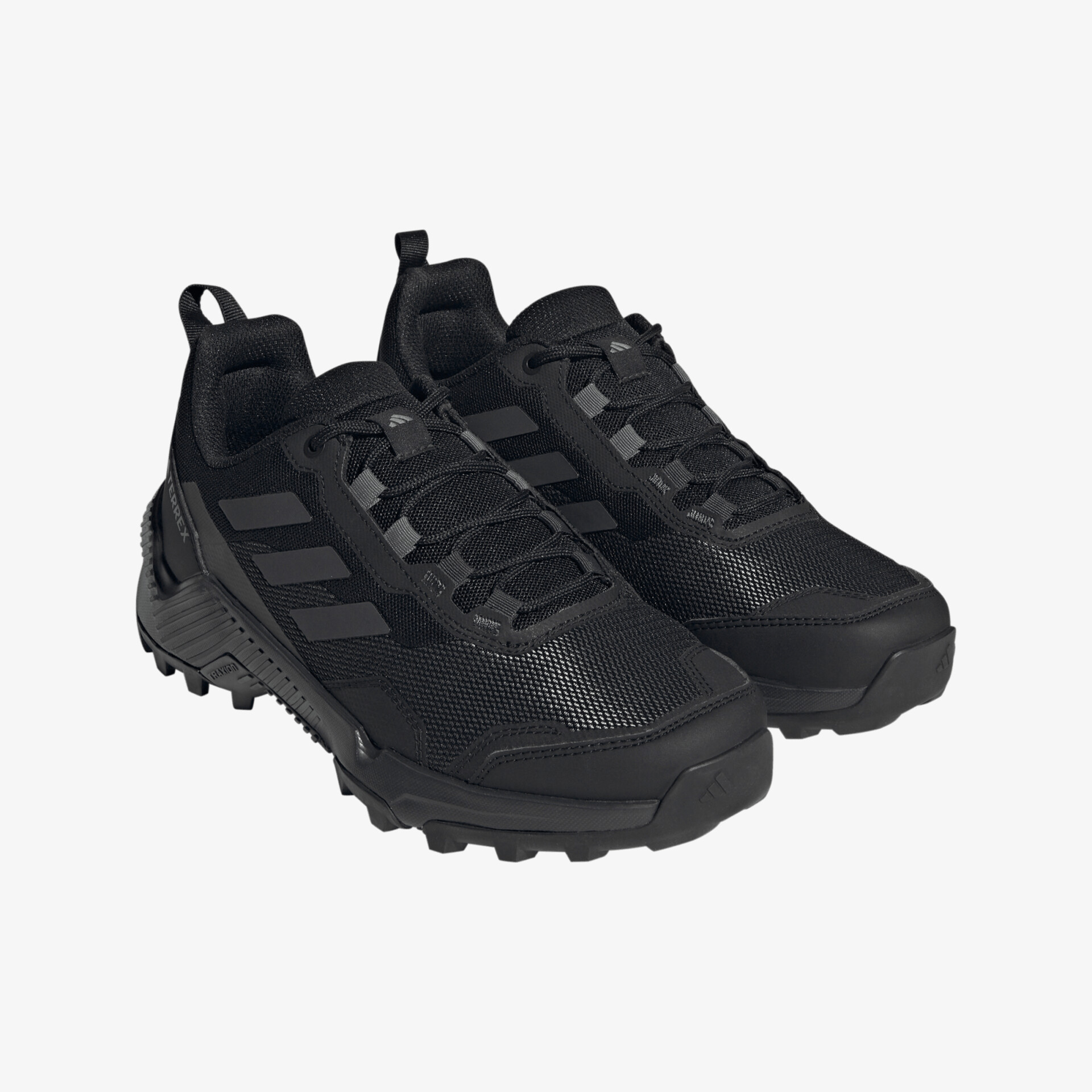 Schwarze, robuste Outdoor-Schuhe mit rutschfester Sohle und atmungsaktivem Design, ideal für jedes Gelände.