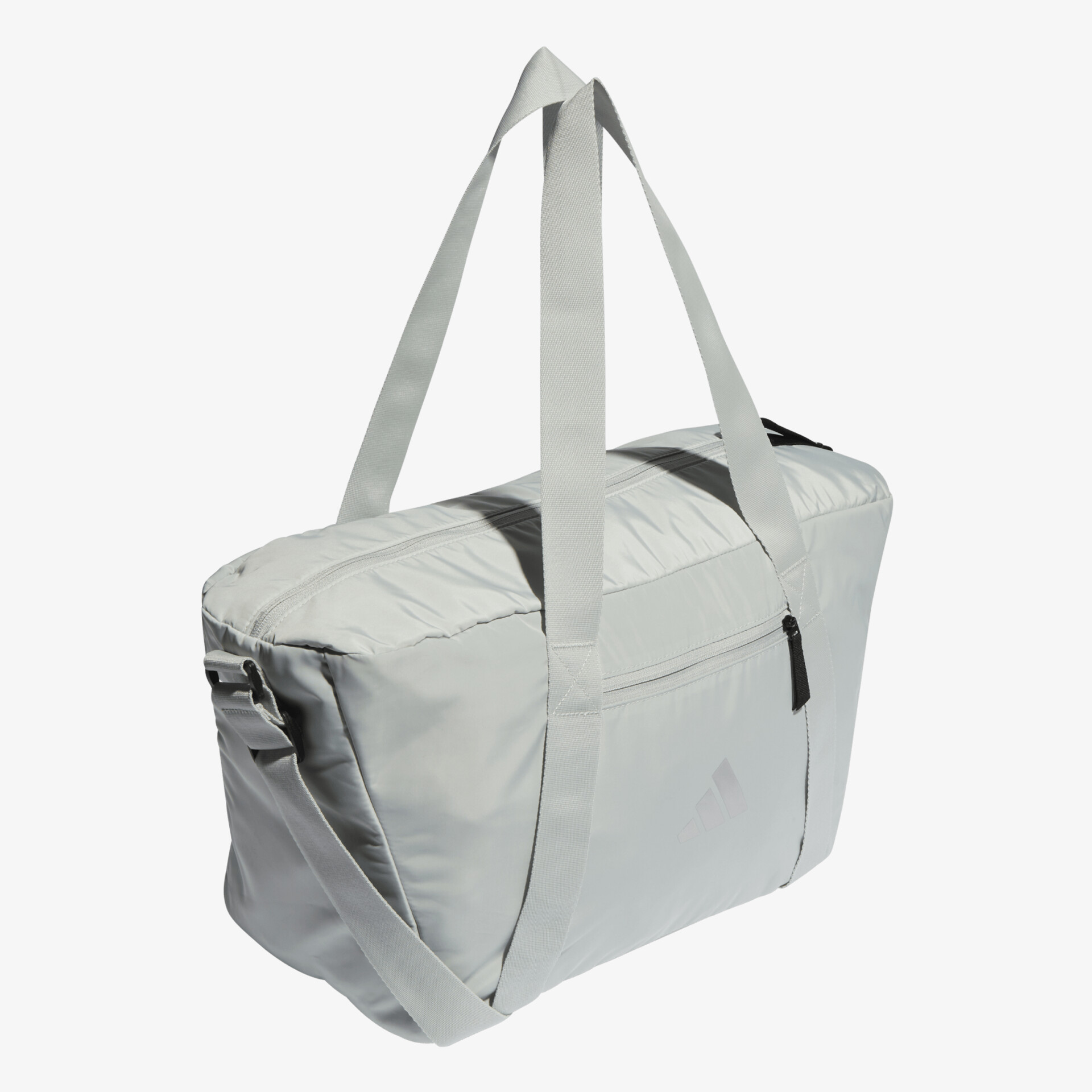 Geräumige, graue Sporttasche mit robusten Trägern, ideal für Reisen oder Sport. Vielseitig und stilvoll.