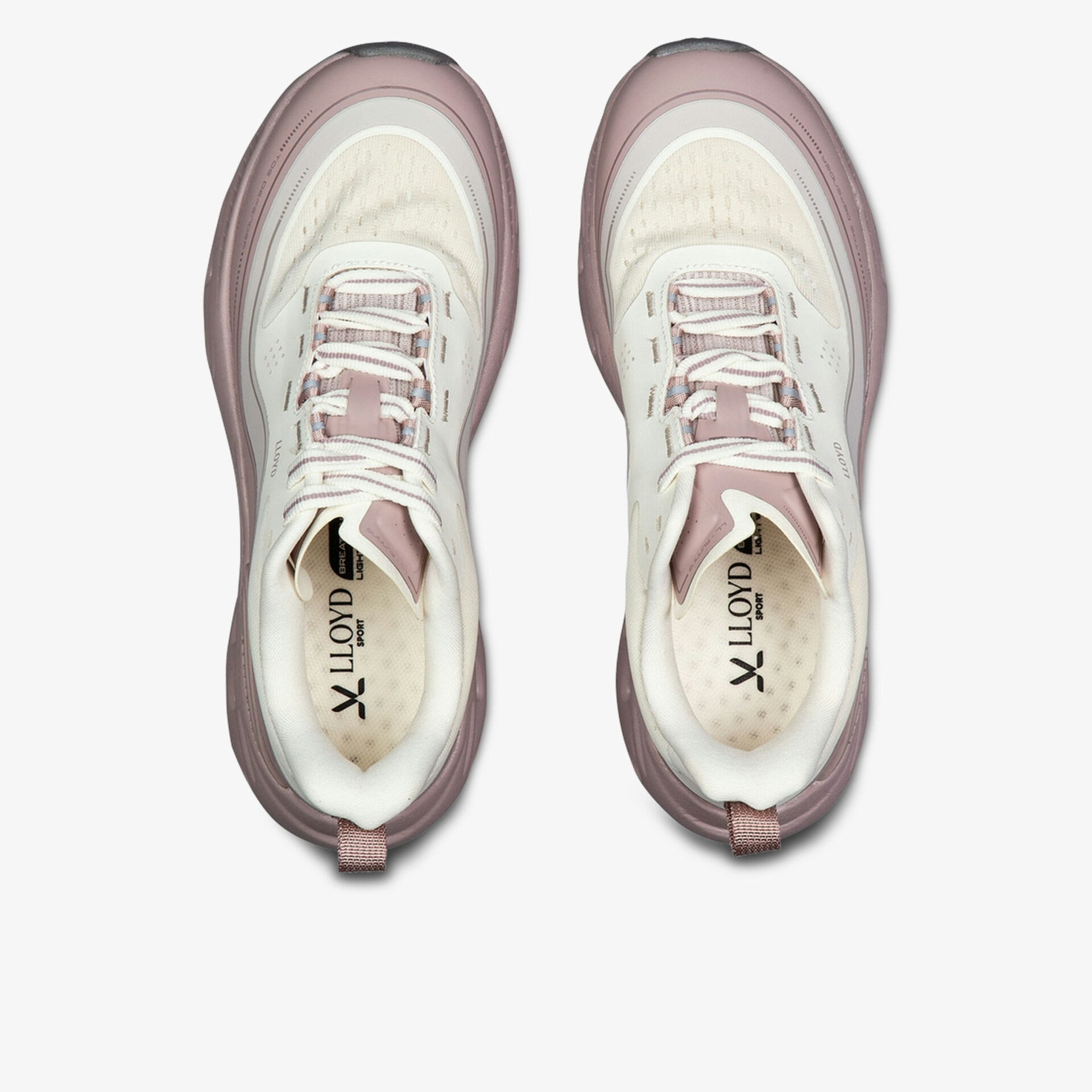 Moderne Sneaker in Rosa- und Weißtönen, ideal für sportliche Aktivitäten und Freizeit.