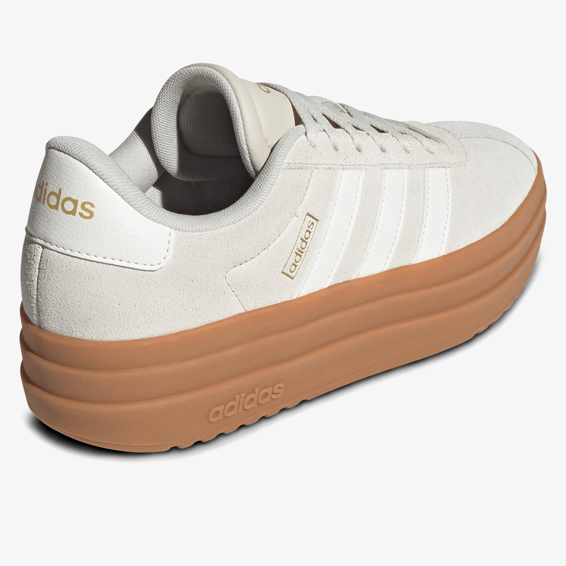 Weißer Sneaker mit dicker brauner Plateau-Sohle und Adidas-Logo, seitliche Ansicht
