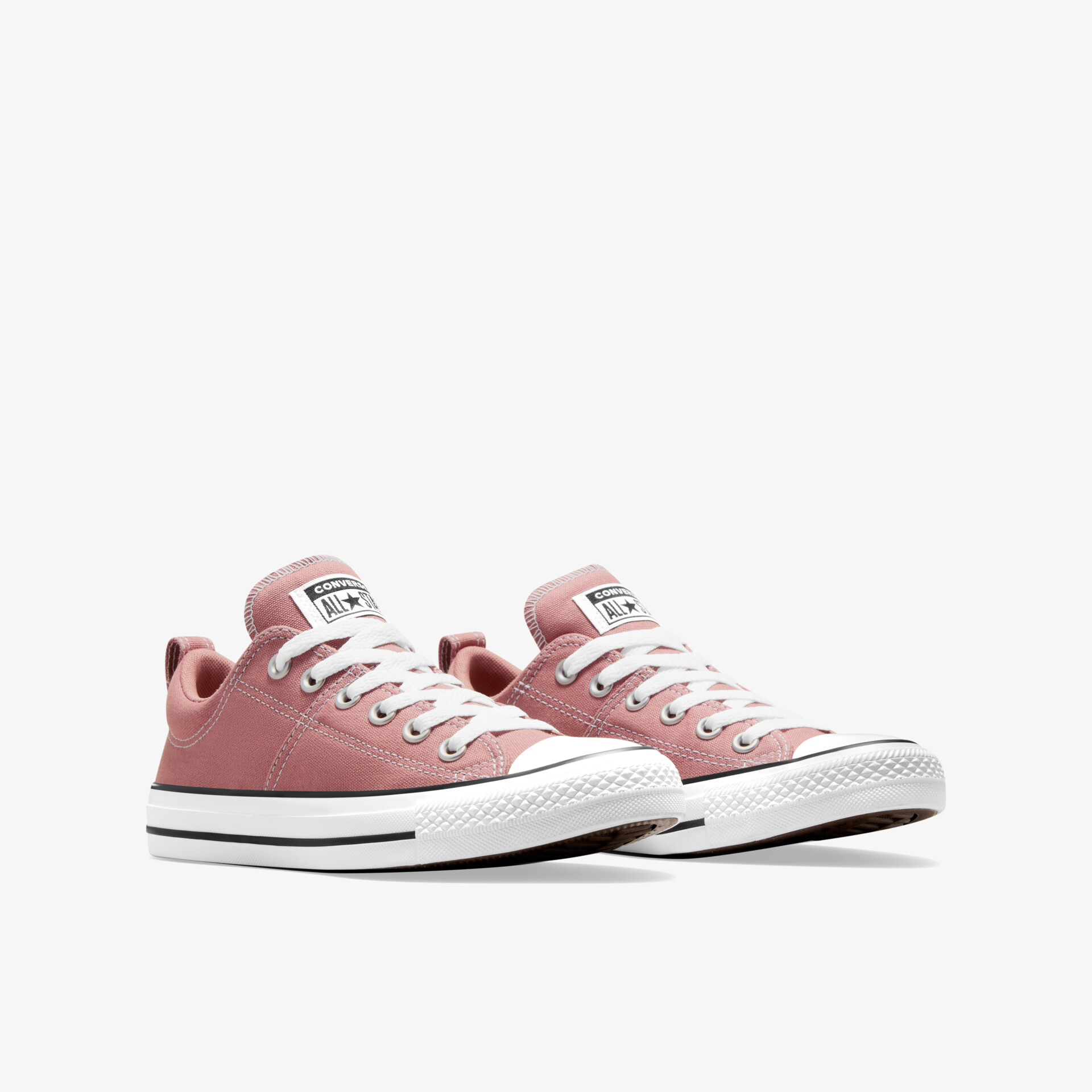 Schräg vorne fotografiertes Paar rosa Sneaker mit robuster Schnürung und leichter, flexibler Sohle