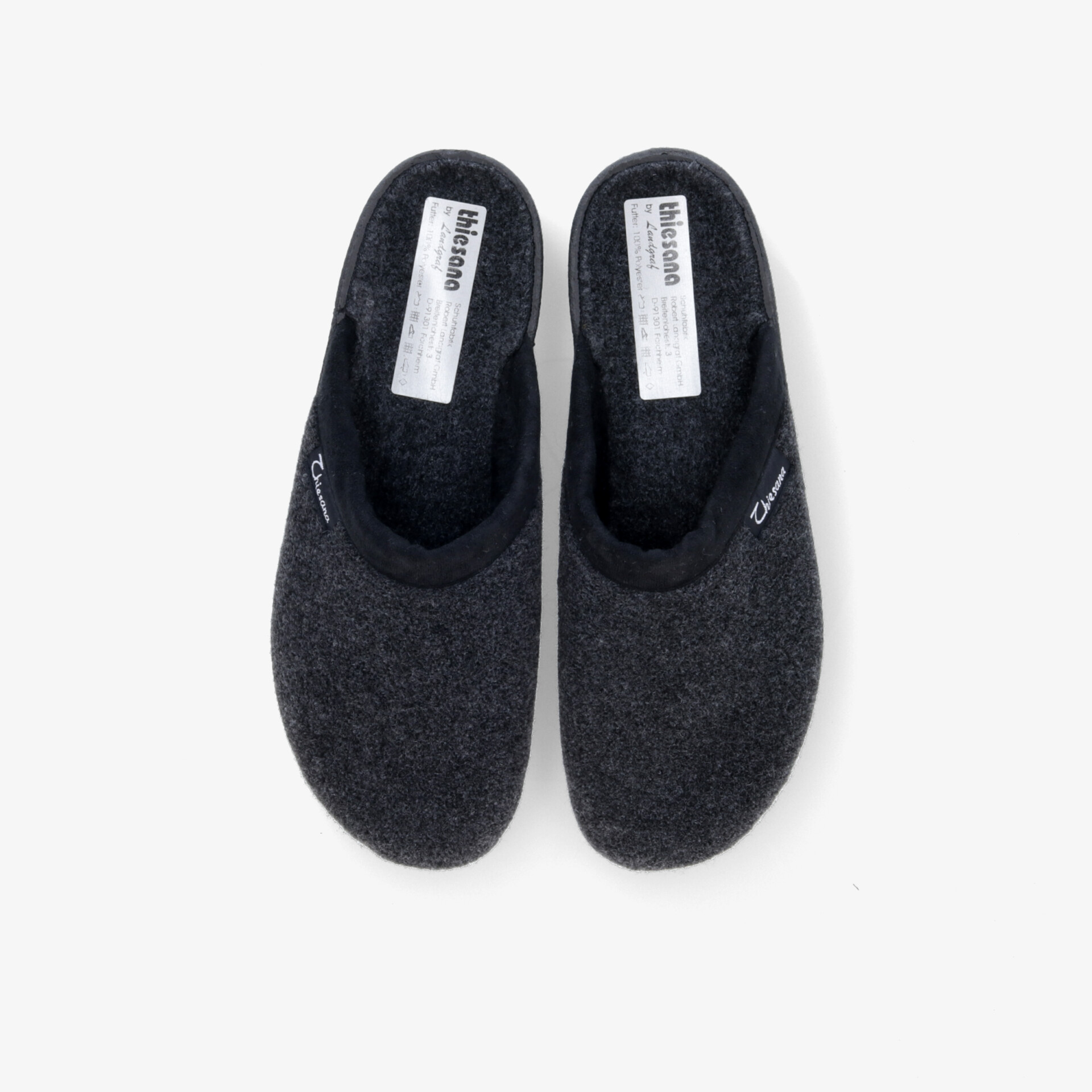 Bequeme Filzhausschuhe in klassischem Design für optimalen Komfort und rutschfeste Sicherheit.
