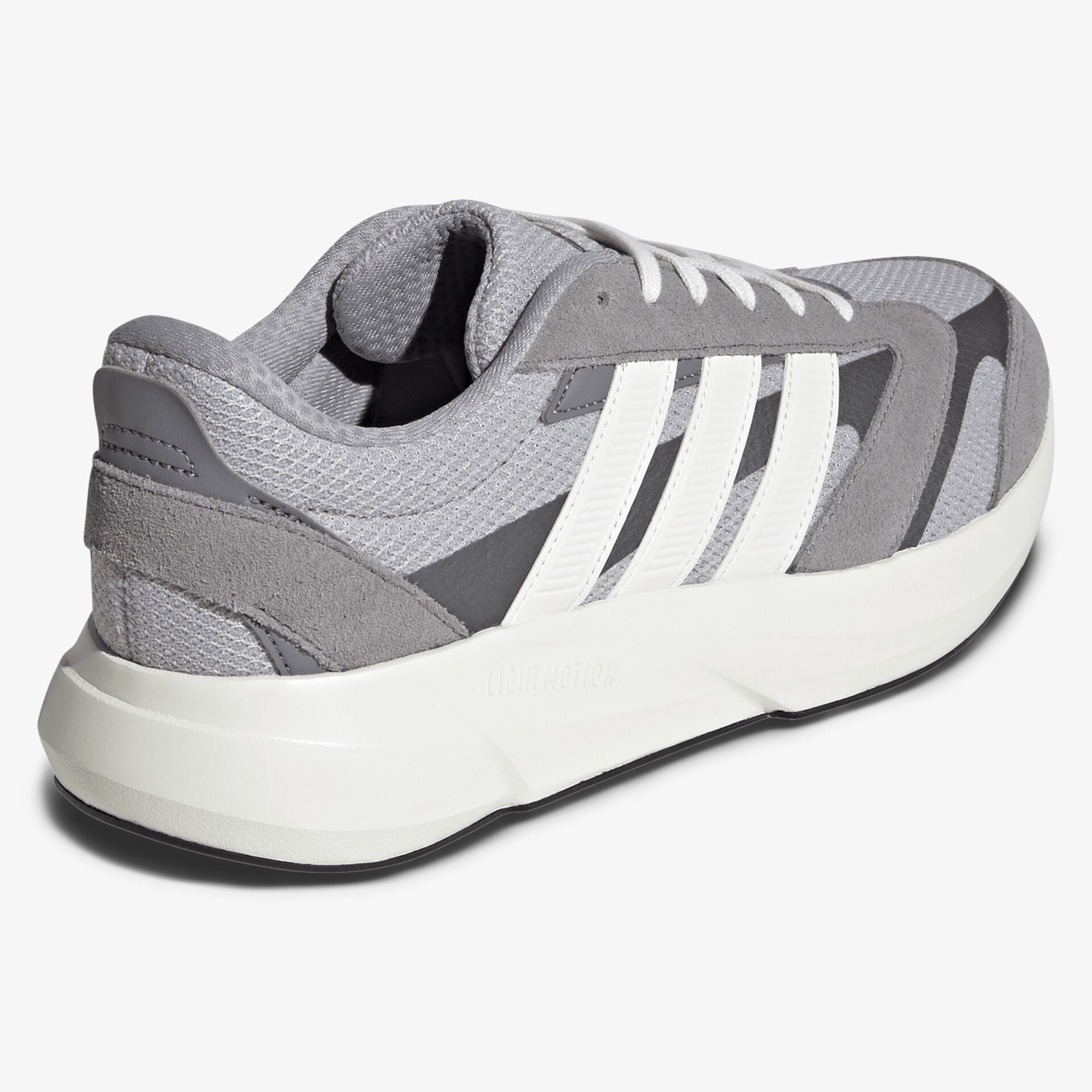 Sportlicher grauer Sneaker mit weißer Schnürung und bequemer Polsterung für komfortables Tragen