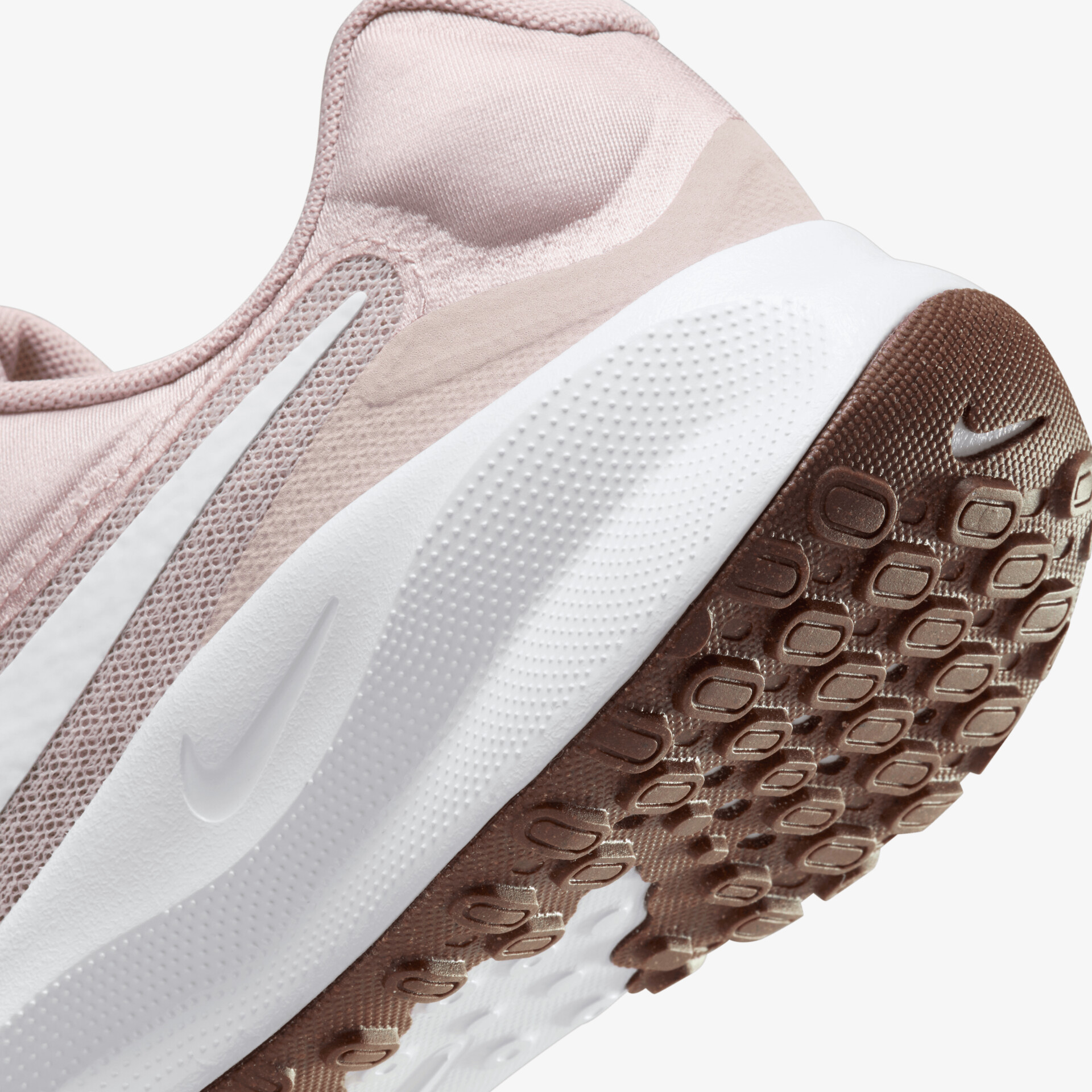 Detailaufnahme der flexiblen, rutschfesten weißen Sohle mit gutem Grip und komfortablem, rosafarbenem Obermaterial