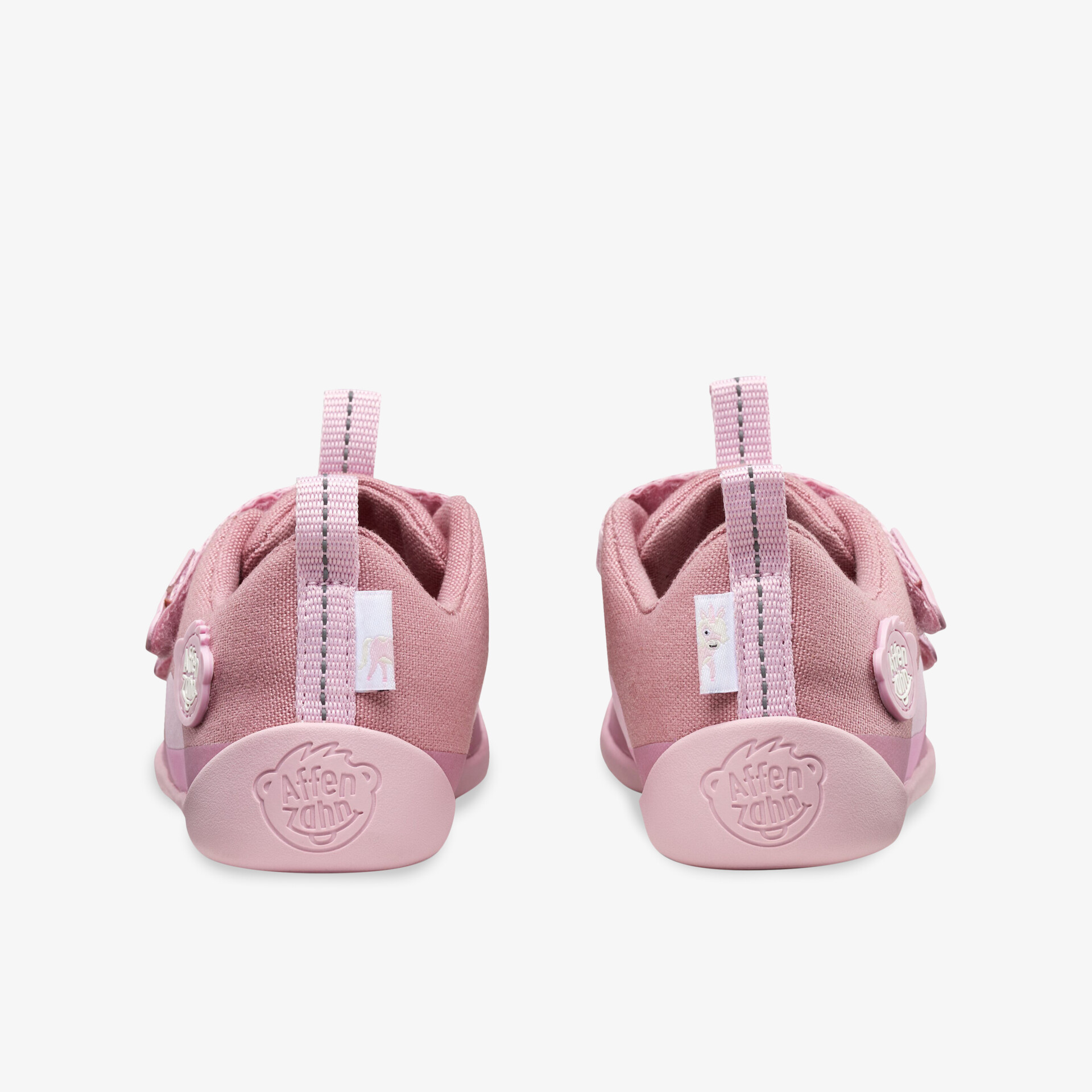 Bequeme rosa Schuhe mit Klettverschluss und rutschfester Sohle für sicheren Halt.