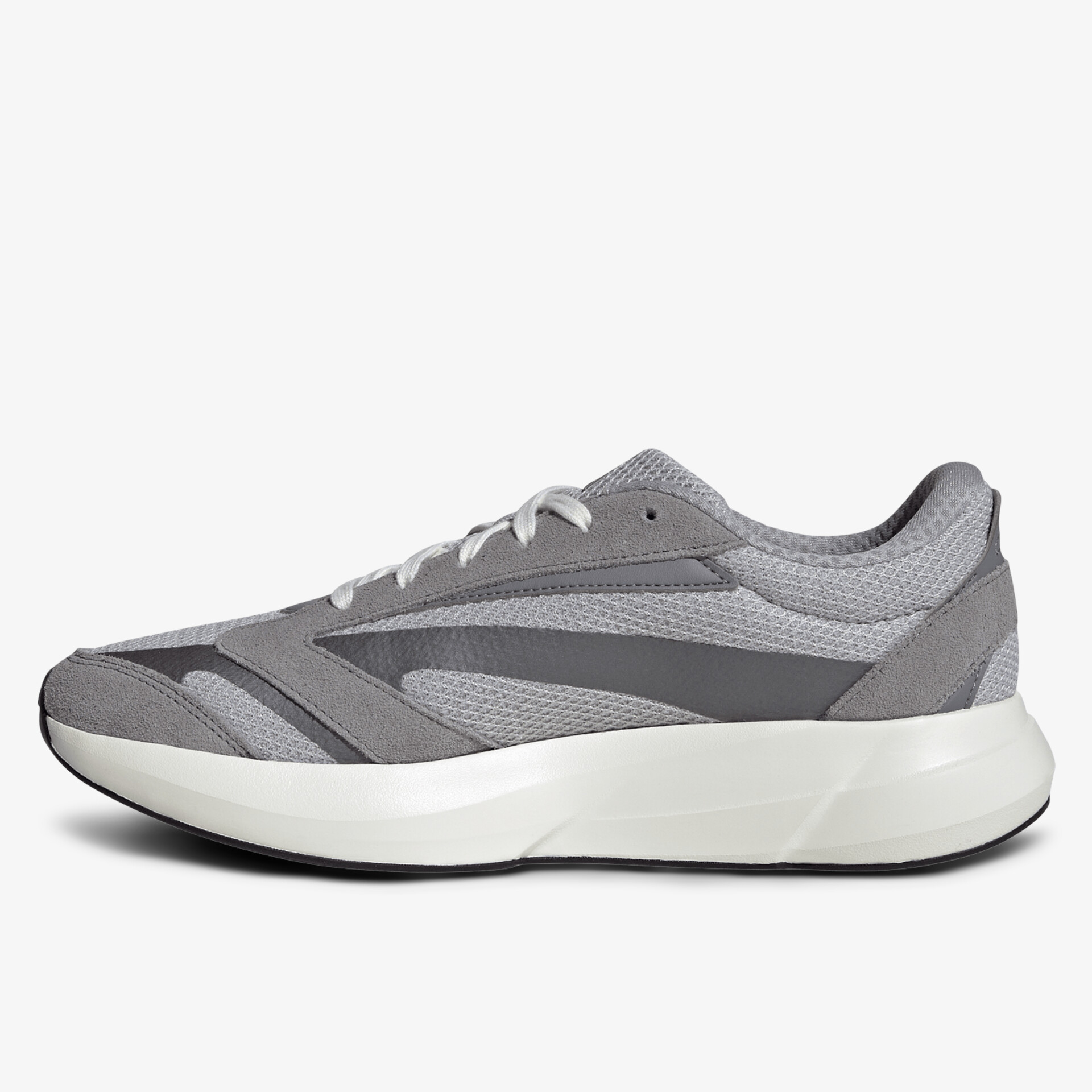 Leichter grauer Sneaker mit atmungsaktivem Mesh, weicher Sohle und modernem sportlichen Design, seitliche Ansicht
