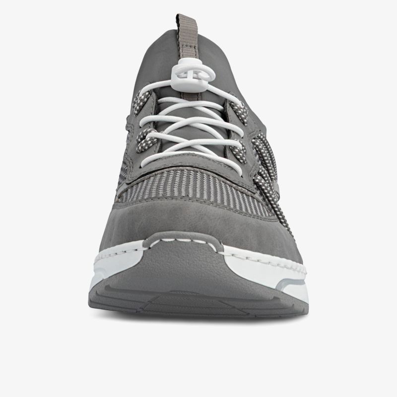 Grauer Sneaker mit robuster Sohle und weißen Schnürsenkeln, komfortables und modernes Design