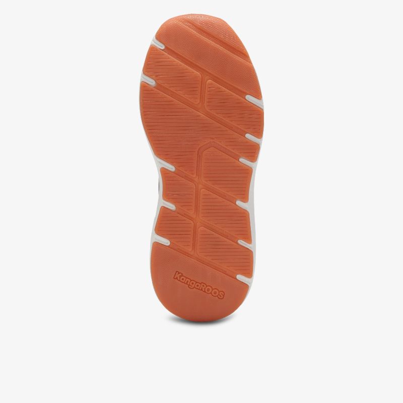 Robuste, rutschfeste Schuhsohle in lebendigem Orange mit tiefem Profil für sicheren Halt
