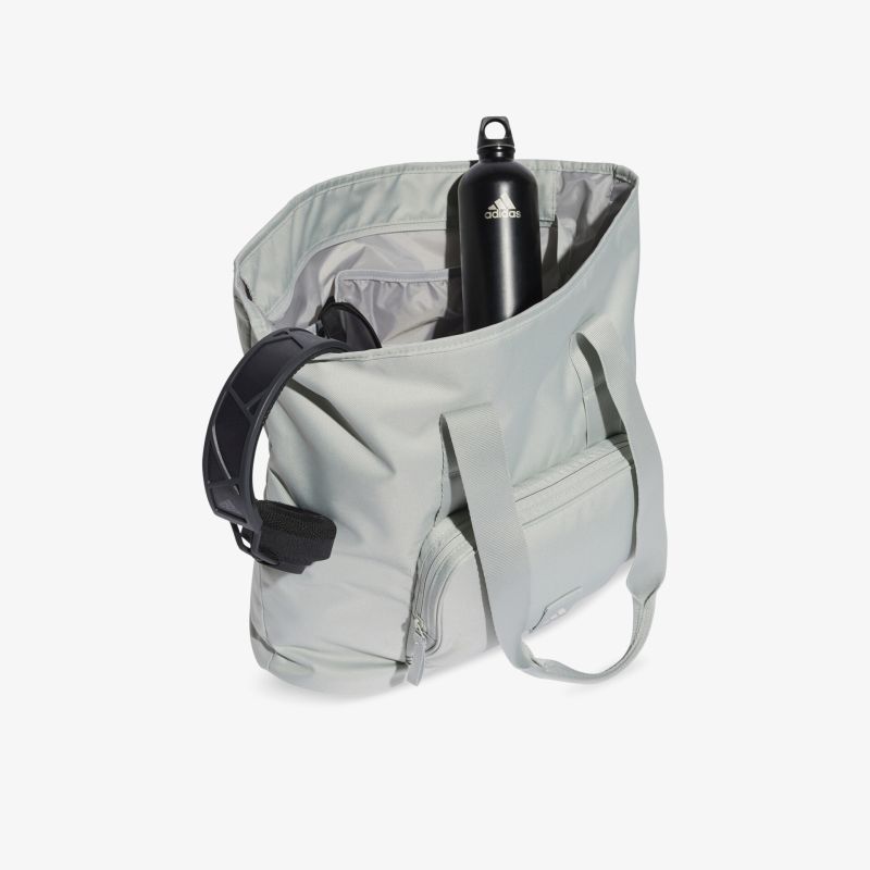 Geräumige graue Tasche mit praktischem Innenraum und robuster Wasserflasche, ideal für unterwegs und sportliche Aktivitäten