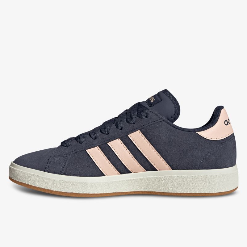 Seitliche Ansicht dunkler Sneaker mit rosafarbenen Streifen und weißer Sohle, modernes Design