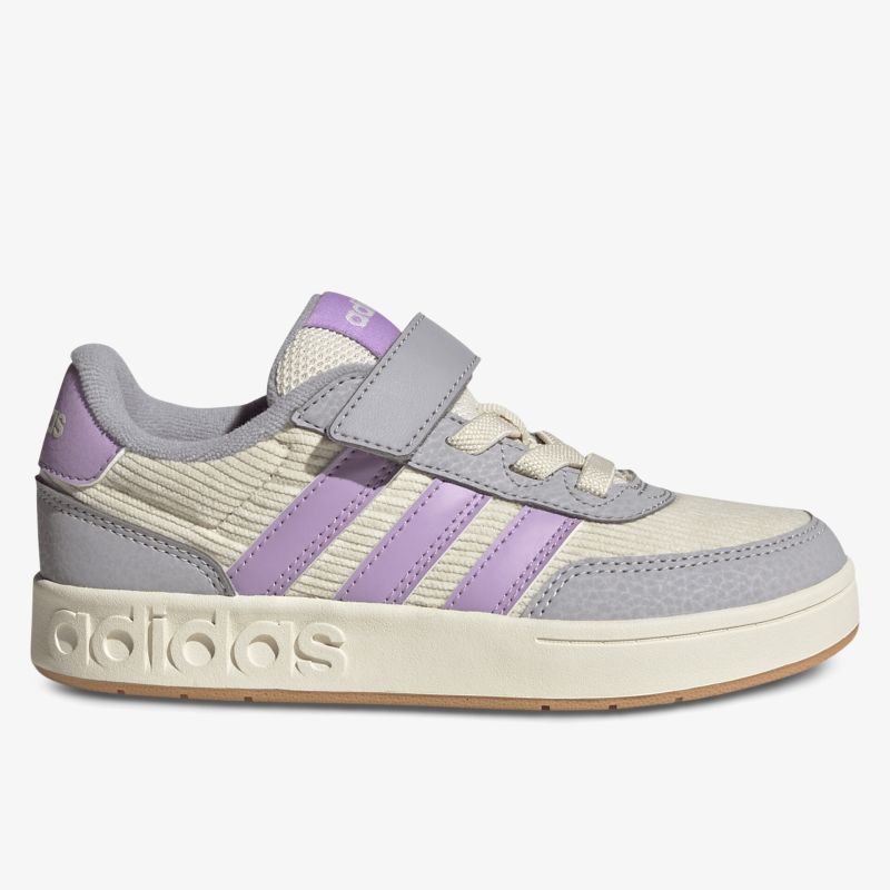 Seitenansicht eines legeren Sneakers mit Klettverschluss, lila Streifen und bequemer Passform