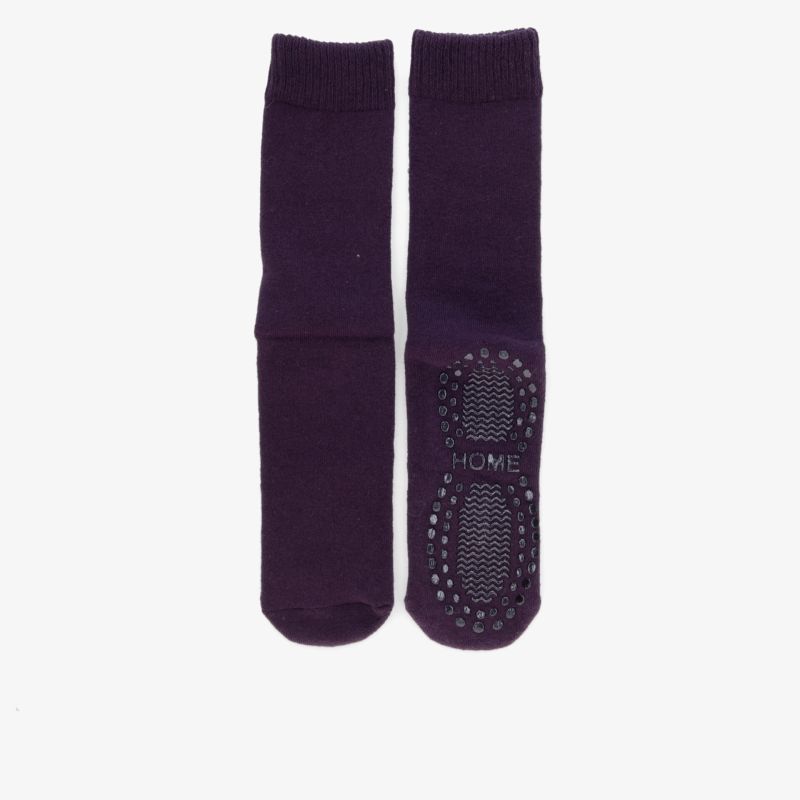 Lilafarbene Socken mit Antirutschsohle für maximalen Komfort und Sicherheit beim Tragen.