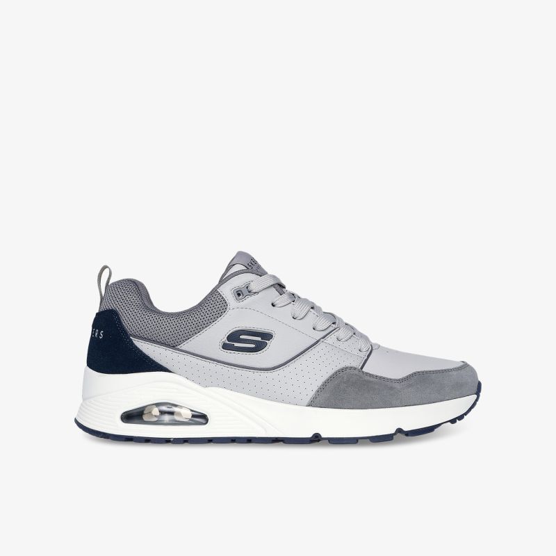 Seitliche Ansicht eines sportlichen grauen Sneakers mit atmungsaktivem Material und dämpfender Sohle