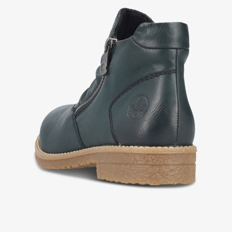 Robuster Lederstiefel in dunklem Grün mit Reißverschluss und profilierter Sohle, seitliche Ansicht