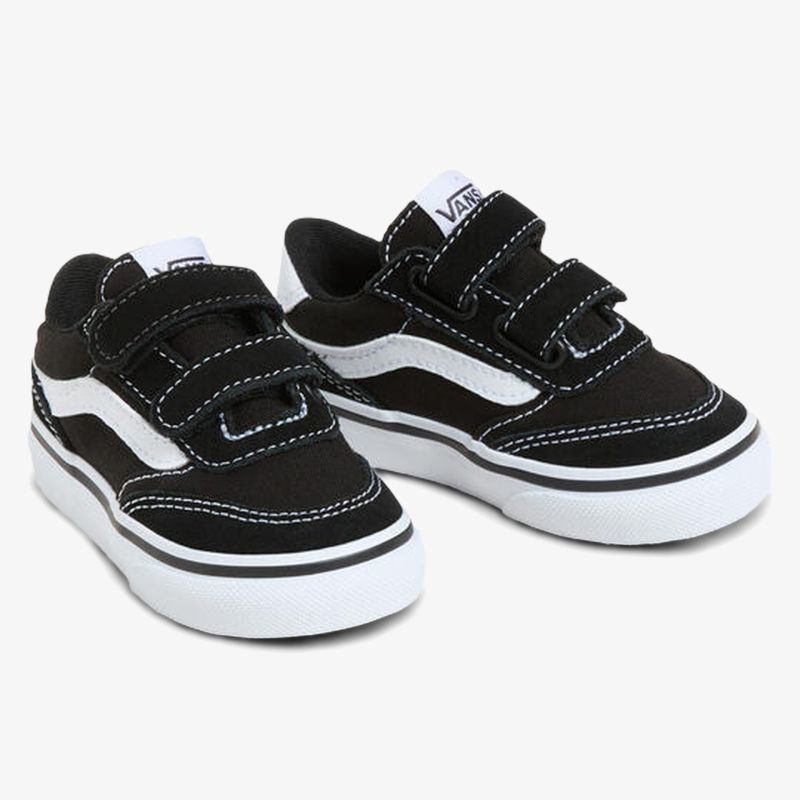 Sportliche schwarze Sneaker mit weißem Streifen und praktischem Klettverschluss, robust und bequem