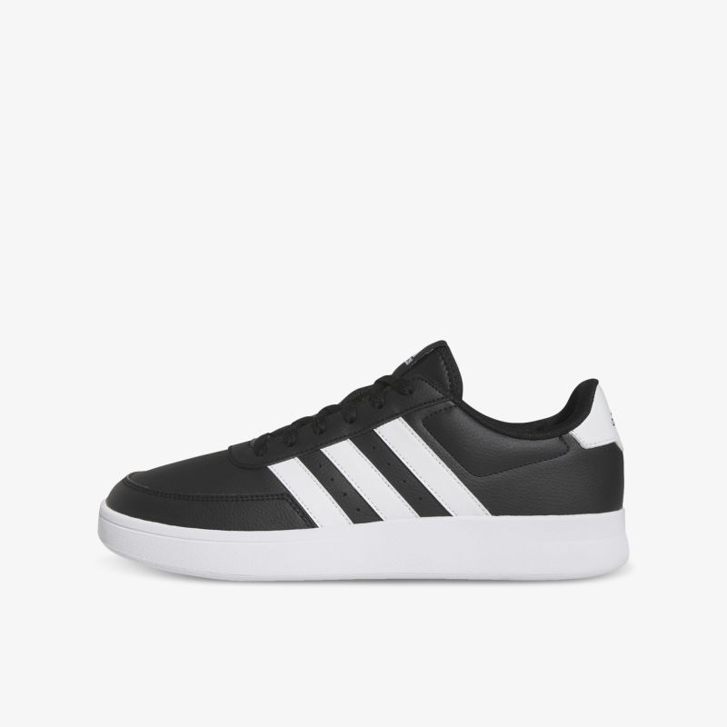 Seitenansicht eines schwarzen Sneakers mit weißen Streifen, leichter, bequemer sportlicher Schuh mit rutschfester Sohle