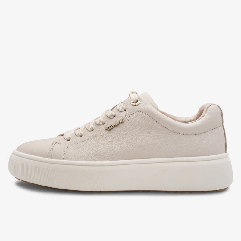 Seitliche Ansicht eines cremeweißen Sneakers mit minimalistischen Design und komfortabler Sohle