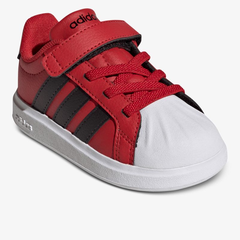 Roter Sportschuh mit robustem Zehenschutz und praktischem Klettverschluss für sicheren Halt