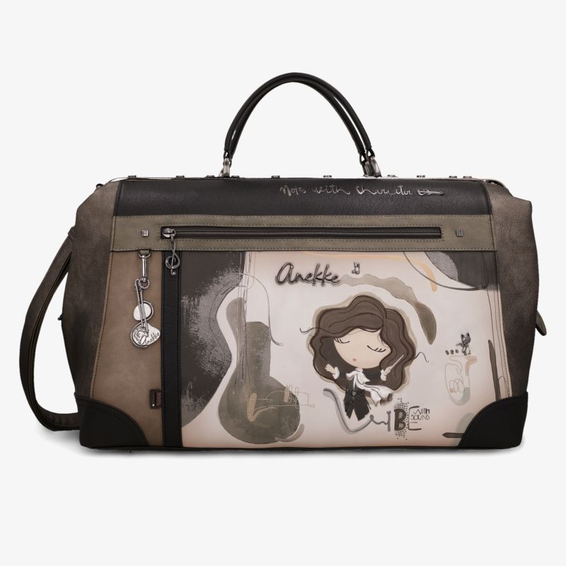 Braune Handtasche mit verspieltem Motiv, zwei Tragegriffen, Schulterriemen und praktischen Reißverschlussfächern