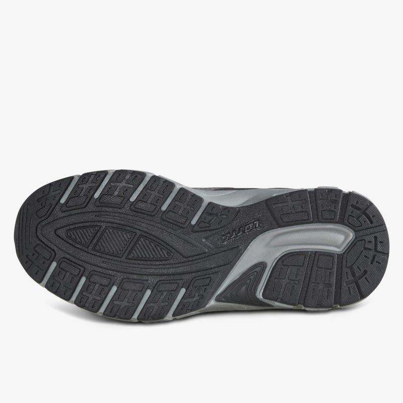 Robuste schwarze Schuhsohle mit tiefem Profil für hohen Grip und langlebige Nutzung