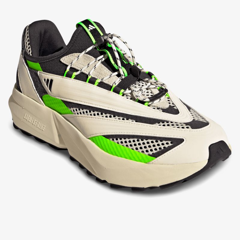 Moderner, sportlicher Schuh mit komfortabler Passform und auffälligen grünen Akzenten.