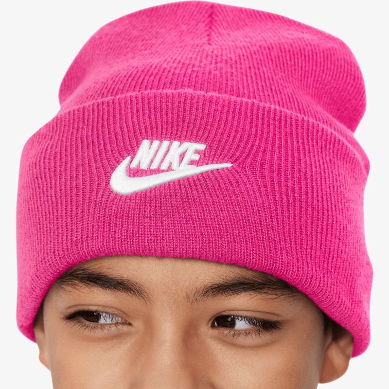 Pink knit beanie with white Nike logo, warm and cozy winter accessory, comfortable fit