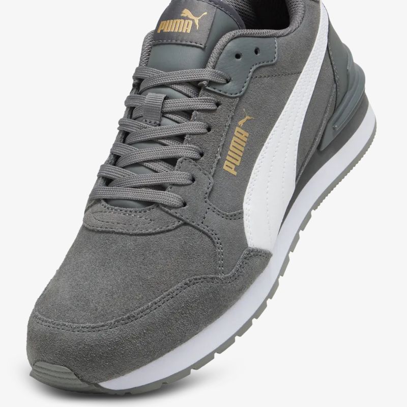 Sportlicher grauer Sneaker aus Wildleder mit weißem Streifen und komfortabler rutschfester Sohle