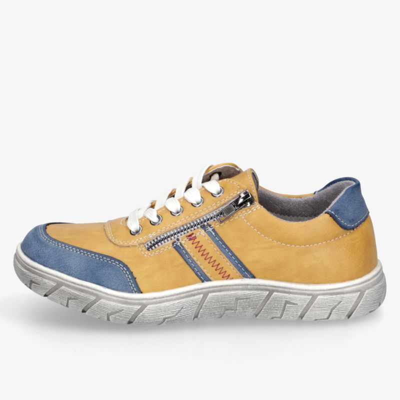 Seitliche Ansicht eines bequemen Sneakers mit robustem Design, atmungsaktivem Obermaterial und praktischem Seitenreißverschluss