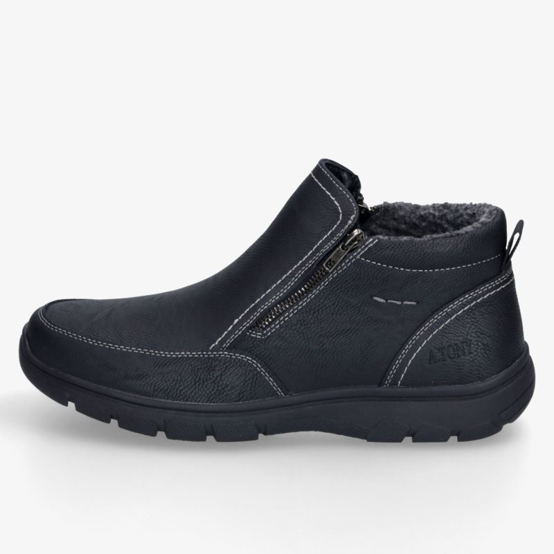 Schwarzer Stiefeletten-Schuh mit Reißverschluss, weichem Innenfutter und griffiger Profilsohle in seitlicher Ansicht.