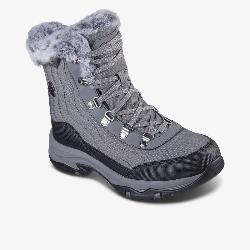 Robuster grauer Winterschuh mit warmem Fellfutter und rutschfester Profilsohle für sicheren Halt