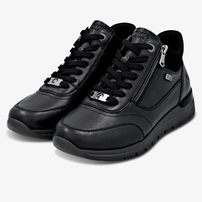 Schwarze sportliche Sneaker mit Reißverschluss und rutschfester Sohle für hohen Tragekomfort