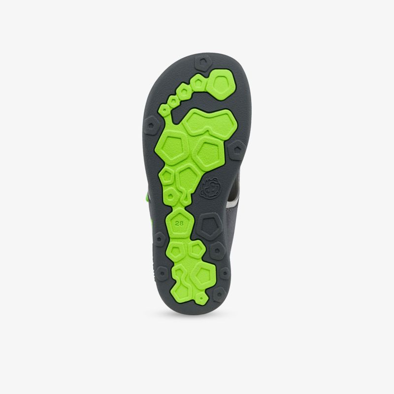 Vielseitige Sohle mit grünem Akzent für ausgezeichnete Traktion und Komfort beim Gehen.
