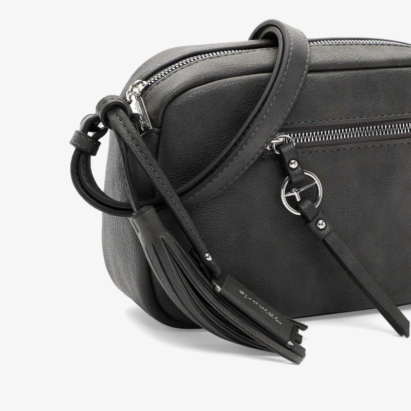 Schwarze, kompakte und fein verarbeitete Tasche mit robustem Reißverschluss und dekorativer Quaste